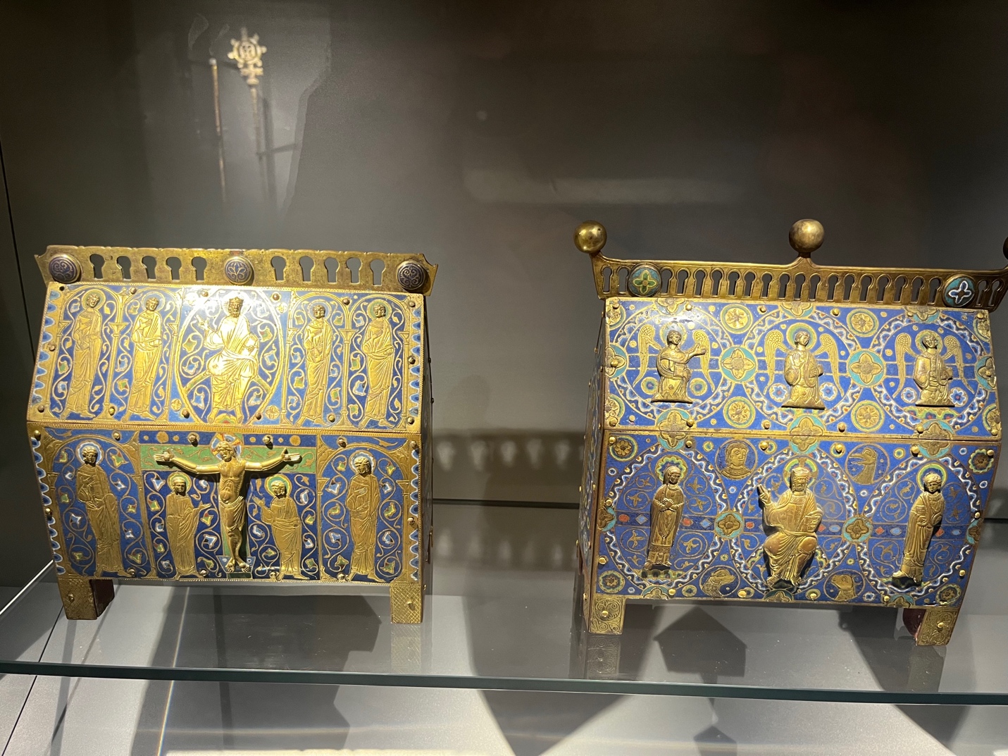 A pair of ornate objects on a glass shelf
AI-generated content may be incorrect.